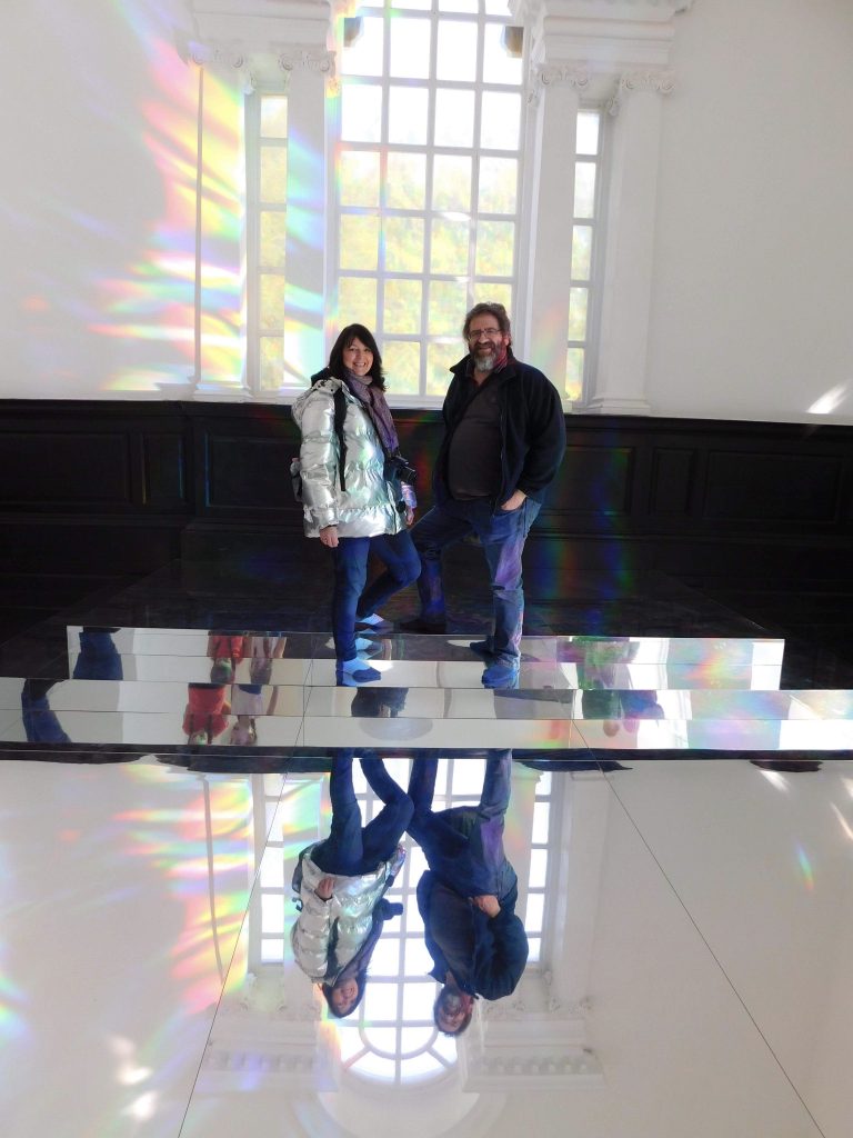 Beverley and Keith stood for a photo on some mirroed steps and flooring invthe 'To Breathe" exhibit at Yorkshire Sculpture Park